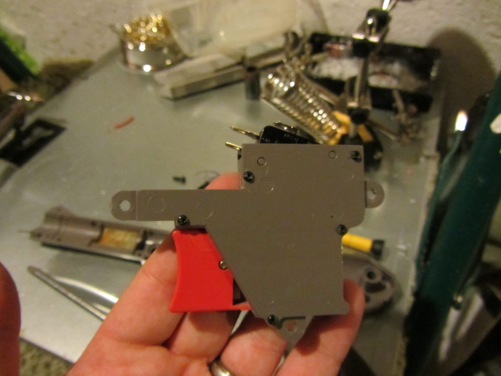 Nintendo gun trigger after resealing the case for the firing mechanism